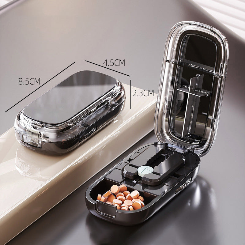 Portable pill organizer with cutter