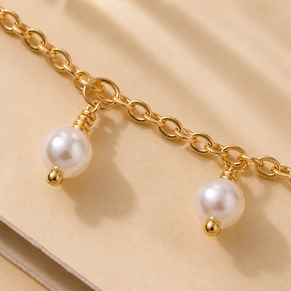 RadianceAura™ – Layered Gold-Plated Bracelets Featuring Pearl & Laurel Accents