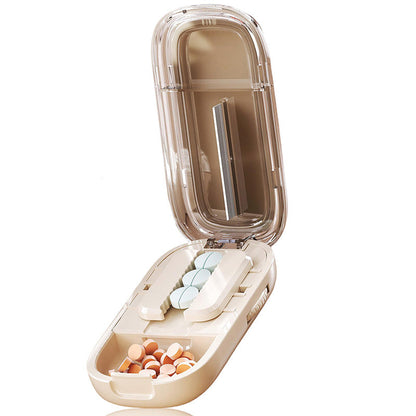Portable pill organizer with cutter