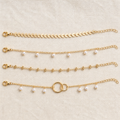 RadianceAura™ – Layered Gold-Plated Bracelets Featuring Pearl & Laurel Accents
