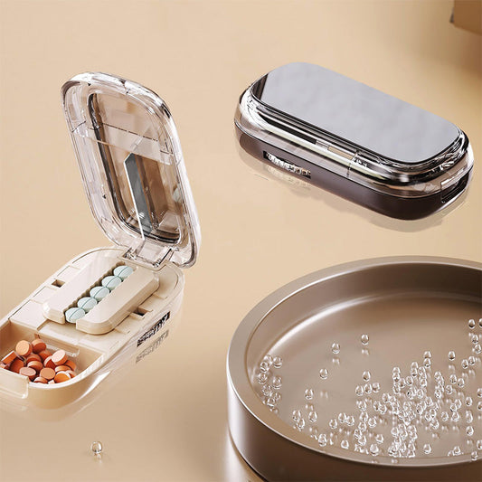 Portable pill organizer with cutter