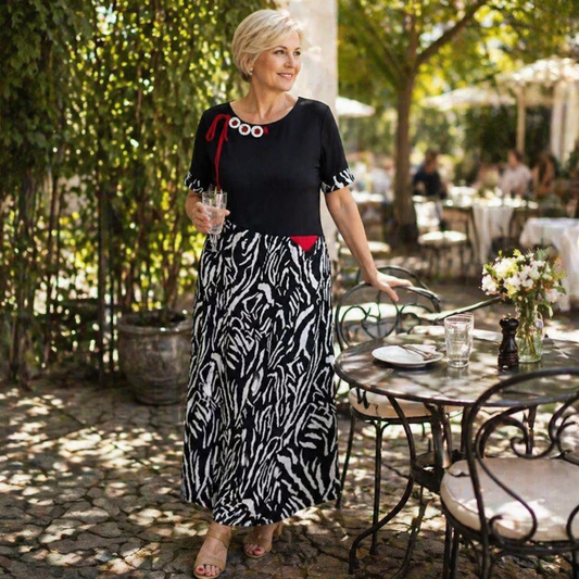 VeraNite™ – Striking Zebra Patchwork Maxi Dress Highlighted with Red Accents