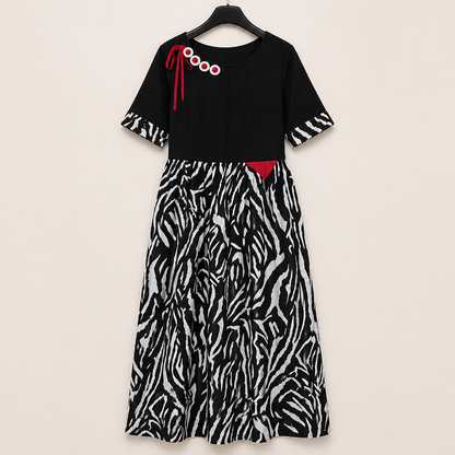 VeraNite™ – Striking Zebra Patchwork Maxi Dress Highlighted with Red Accents