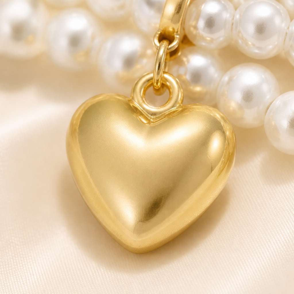 LumaLuxe™ – Elegant Triple-Strand Pearl Necklace with Gold Heart Charm