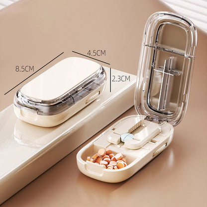 Portable pill organizer with cutter